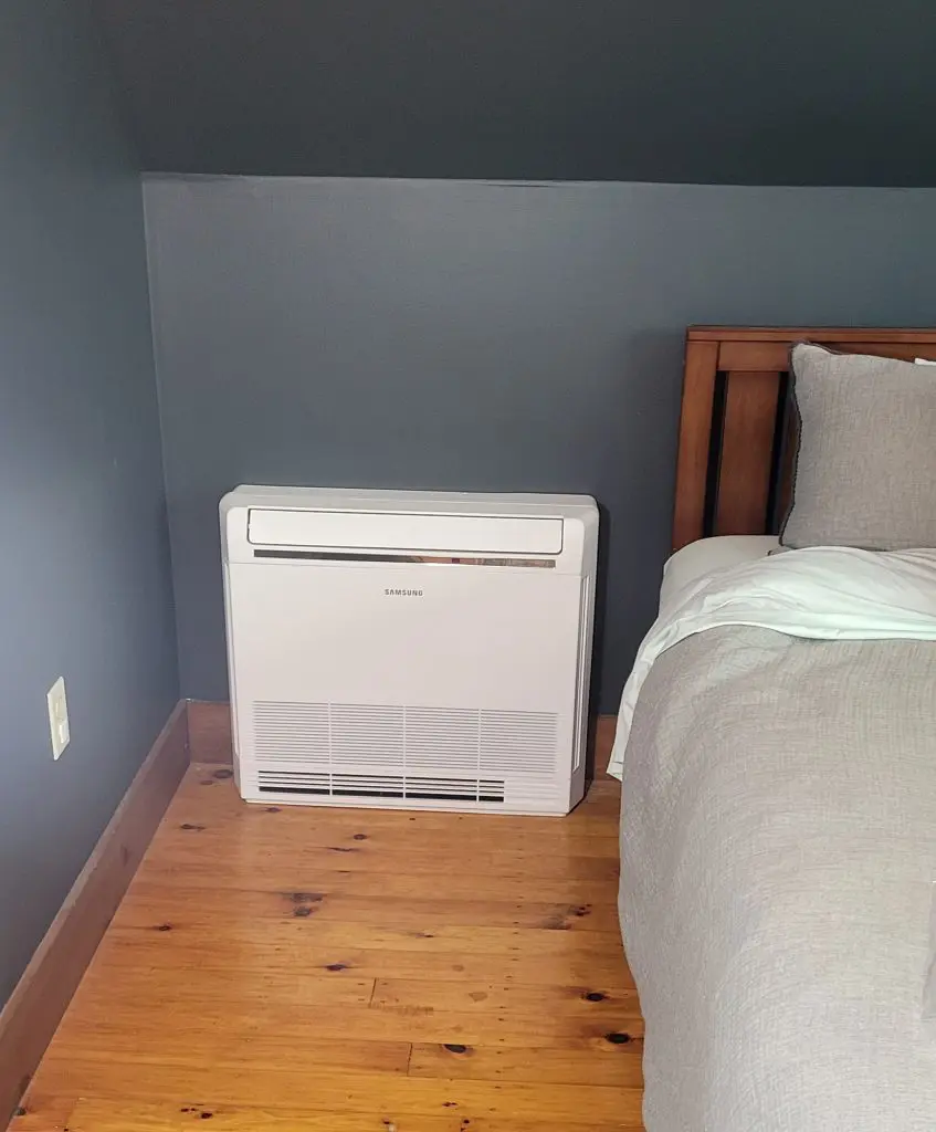 An indoor free standing heat pump installation